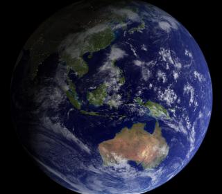 A photo of a nearly full Earth as seen from space. The land masses of Australia and India can be seen, amidst a lot of deep blue ocean and white clouds.