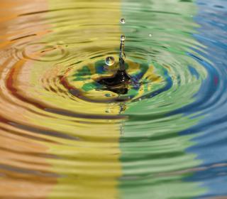 Rainbow reflected in water