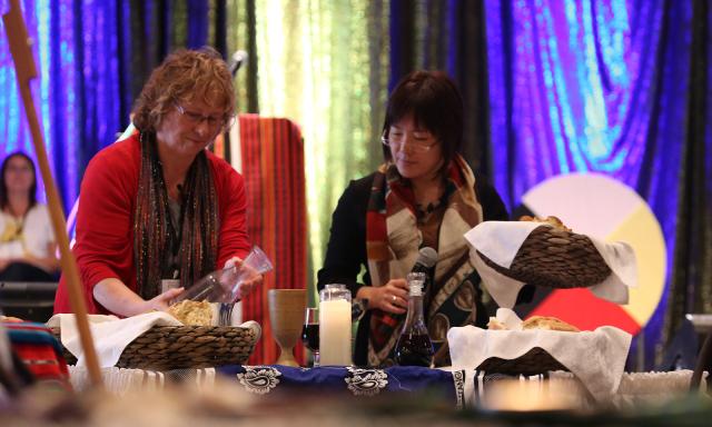 Rev. Hazel Arbon and Rev. Yoko Kihara lead communion at a Behold! national conference Communion at Behold 2013