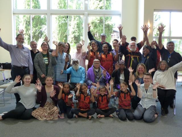 The Australian and Canadian members of the Dialogue on Reconciliation gather and wave to the camera.