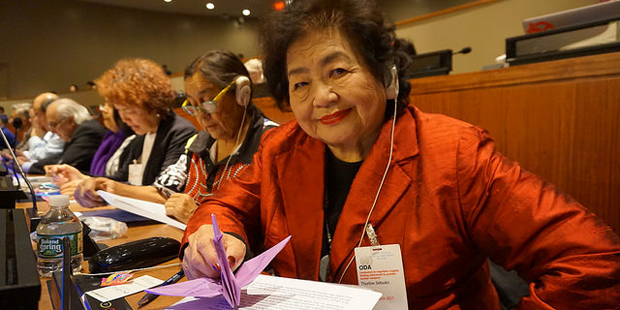 United Church member Setsuko Thurlow, during nuclear disarmament negotiations, turning toward the camera.