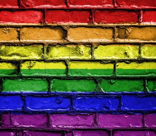 A brick wall painted like a rainbow
