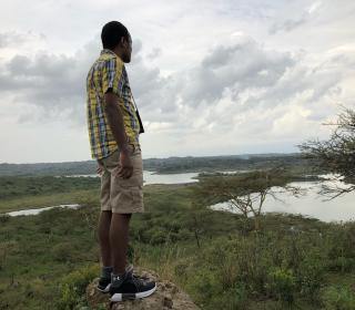 The author Adam Kilner looking out over the Tanzanian landscape.
