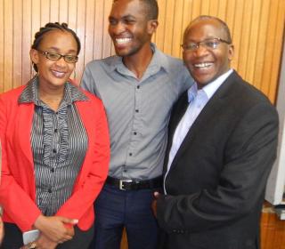 Three members of Pembizo Christian Council, Africa smiling.