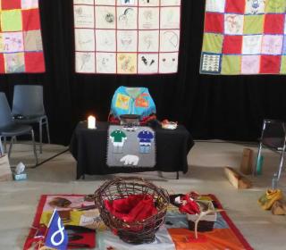 An altar at the Missing and Murdered Indigenous Women and Girls hearing in Maliotenam, Quebec.