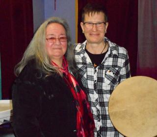 Moderator Jordan Cantwell (right) and Agnes Spence (left) from Nelson House, Manitoba with the drum she made for The Moderator.