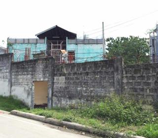 A maximum security prison in the Philippines, ringed with barbed-wire.