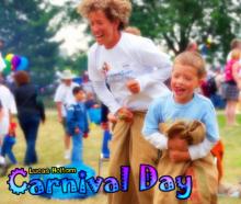 An adult and child enjoying a sack race at the Lucas Holtom Carnival.