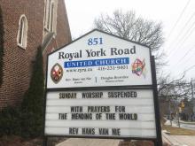 A church sign outside Royal York United Church says "Church Suspended, with Prayers for Mending of the World."