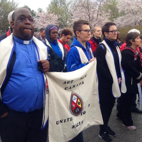 The author Paul Douglas Walfall (left), with the United Church delegation to the ACT March to End Racism, Washington D.C., April 2018. The author Paul Douglas Walfall (left) marches with the members of the United Church of Canada Delegation to the ACT March to End Racism carry a United Church banner at the event.