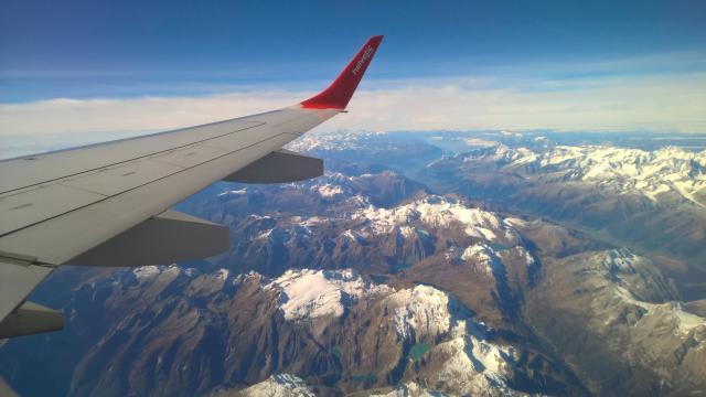 Airplane flying over mountains