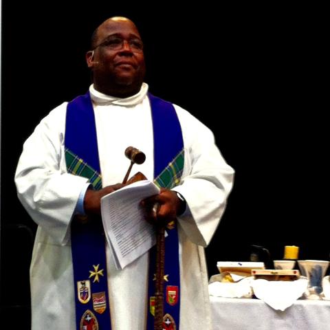 Rev. Paul Douglas Walfall Rev. Paul Douglas Walfall in his clergy robes, presiding over a meeting in the United Church's Alberta and Northwest Conference.