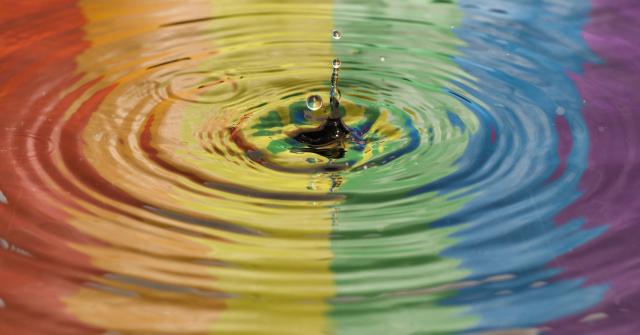 Rainbow reflected in water