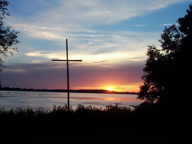 Cross at Scugog Lake Camp against sunset