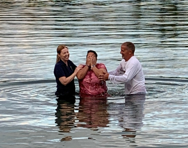 The Rev. Kimberly Heath (left) and Jason Holmes (right) baptize Christina Whyte by full immersion in the St. Lawrence River as part of an outdoor service on September 8, 2019. Baptism in the St. Lawrence