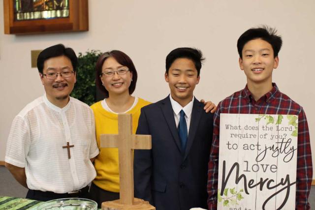The author, SunDo Hyun (left), and family. The author, SunDo Hyun, and family
