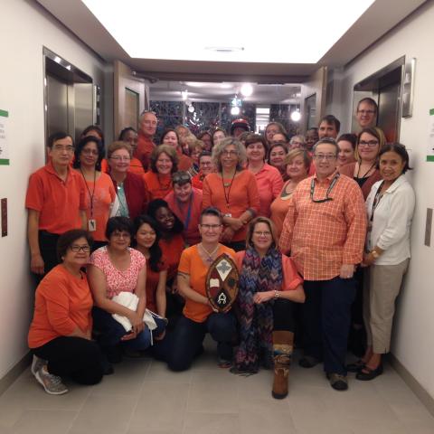The United Church General Council staff gather in orange shirts, marking Orange Shirt Day which remembers the children who attended Residential Schools.