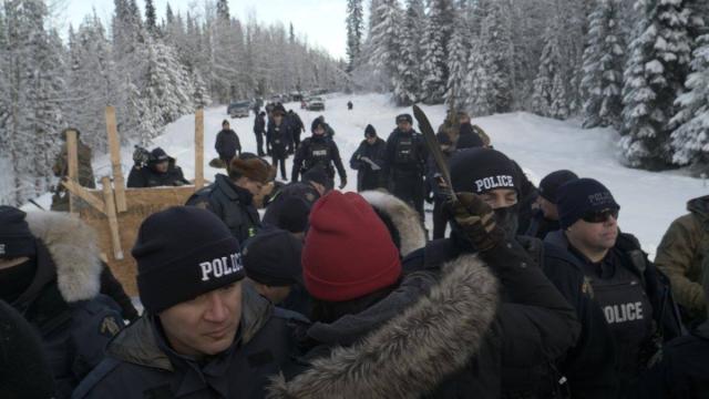 RCMP officers on Wet’suwet’en traditional territory Photo of police and protesters at Wet'suwet'en First Nation, BC